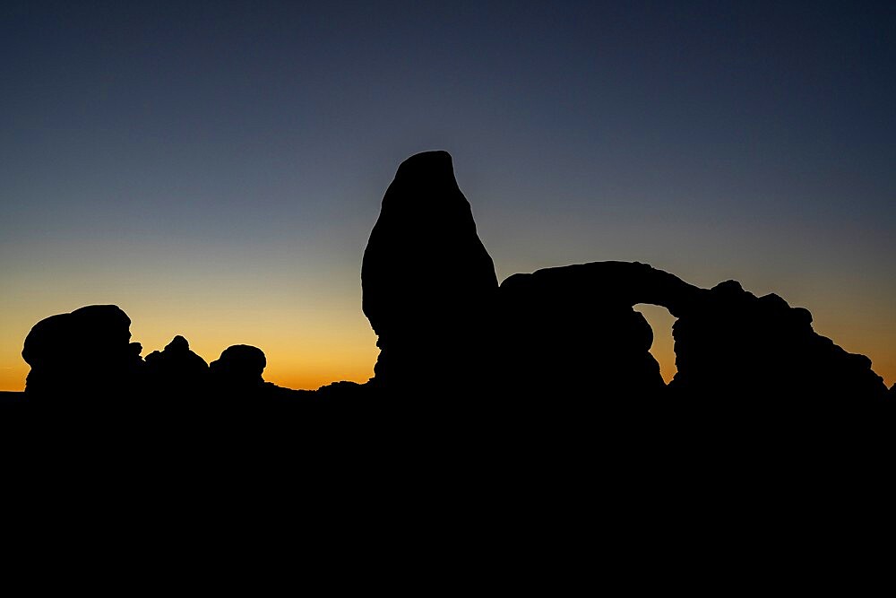 Silhouette of Turret Arch at sunset, Arches National Park, Utah, United States of America, North America