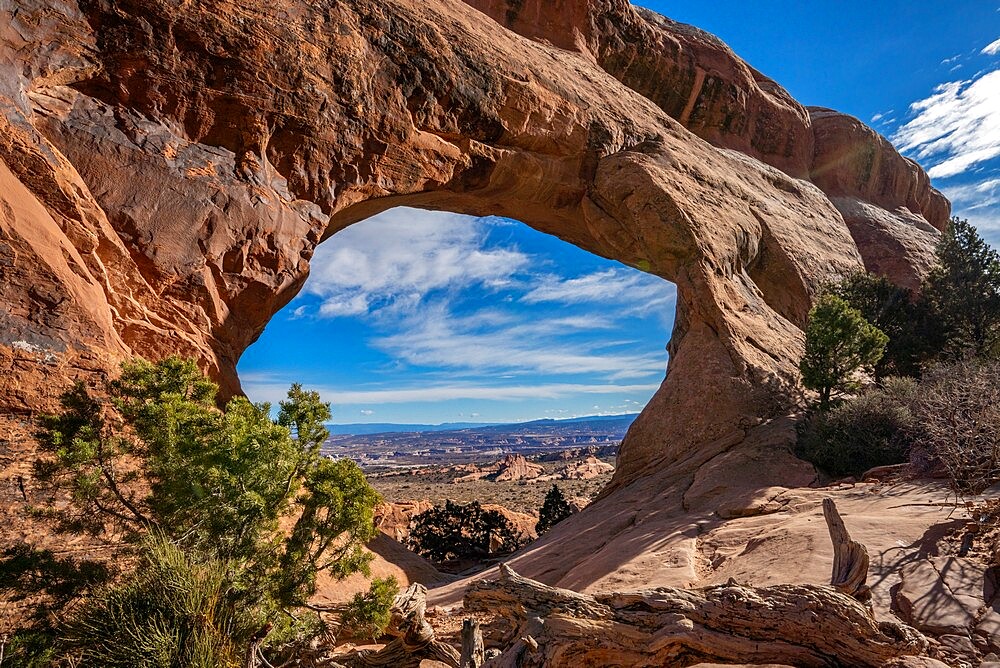 Desert landscape viewed through Partition Arch, Arches National Park, Utah, United States of America, North America