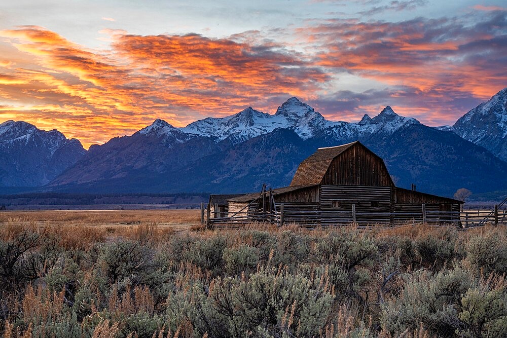 Sun setting over the Teton Range at Moulton Barn, Grand Teton National Park, Wyoming, United States of America, North America