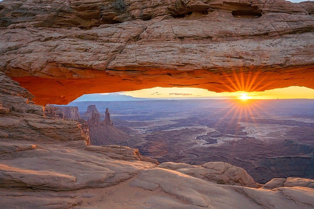 Close up view of canyon through Mesa Arch at sunrise, Canyonlands National Park, Utah, United States of America, North America