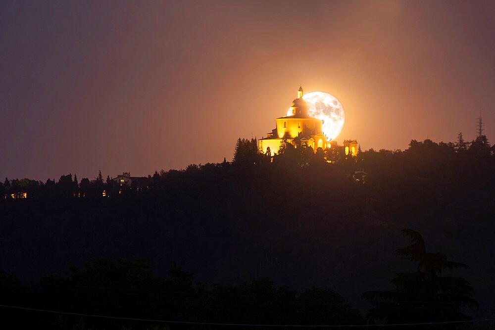 Full moon rising behind San Luca Basilica in Bologna, Emilia Romagna, Italy, Europe