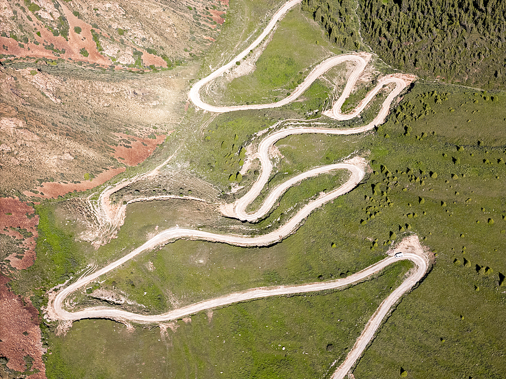 Aerial view of the winding mountain road at Kalmak-Ashu Pass, Kyrgyzstan, Central Asia, Asia