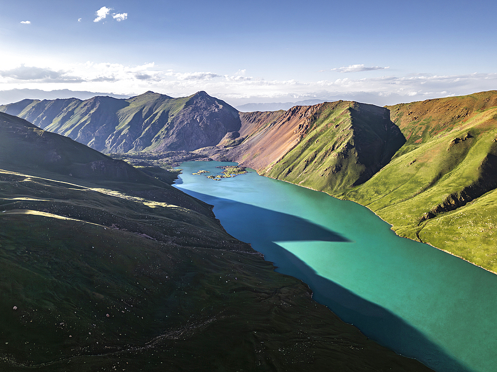 Aerial View of Kol Ukok Lake surrounded by Green Mountains under a blue sky, Kyrgyzstan, Central Asia, Asia