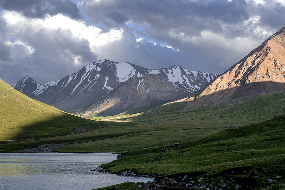 Scenic mountain landscape of Kyrgyzstan with lush Greenery and Snow-Capped Peaks overlooking Kol Ukok Lake, Kyrgyzstan, Central Asia, Asia