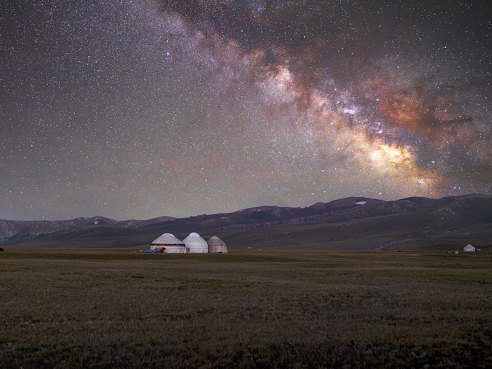 Yurts illuminated by the Milky Way in the SongKol Lake area of Kyrgyzstan