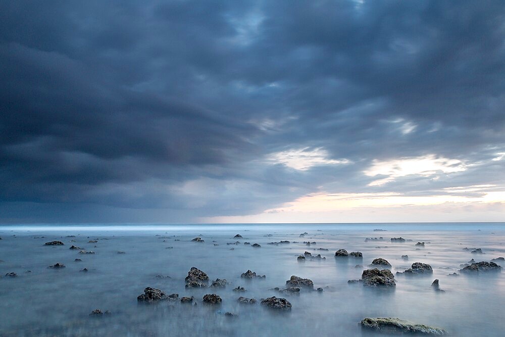 Long exposure of a storm approaching the Gili islands, Lombok, Indonesia, Southeast Asia, Asia