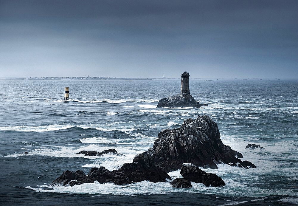 View of the ocean at Pointe du Raz with two lighthouses, Phare de la Vieille and Tourelle de la Plate (Petite Vieille), in the sea and rocks, Finistere, Brittany, France, Europe