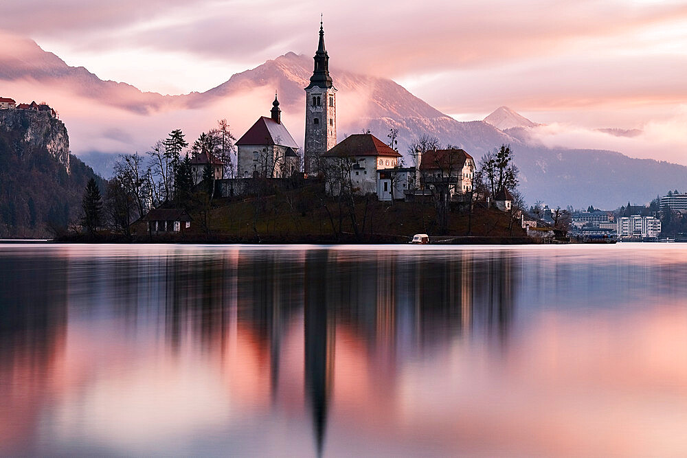 A church in the island in the middle of Bled lake at sunrise, Slovenia, Europe