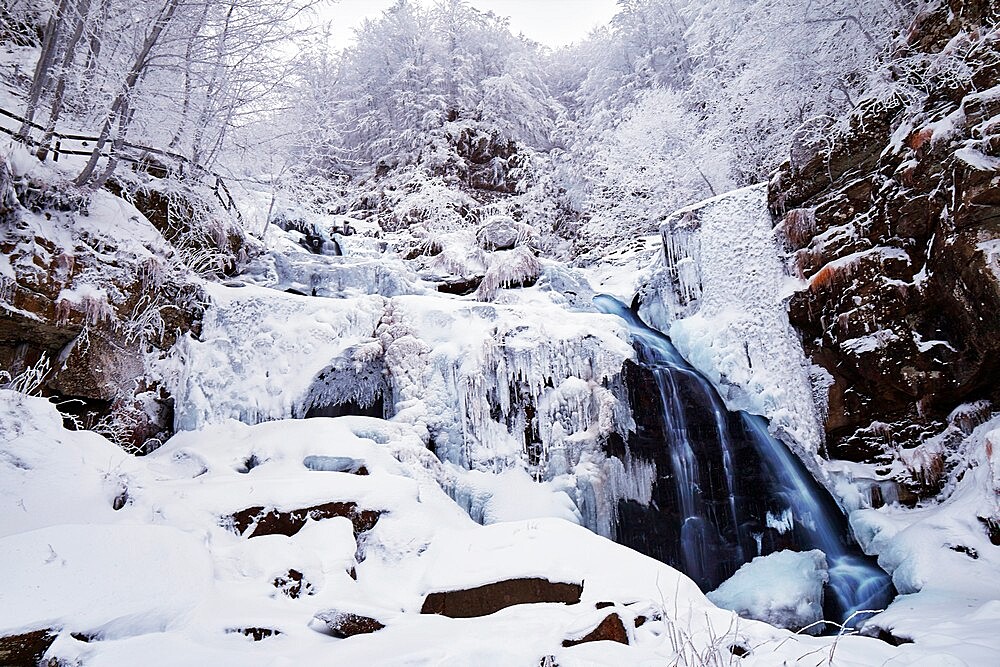 Frozen Dardagna waterfalls in winter with snow, Parco Regionale del Corno alle Scale, Emilia Romagna, Italy, Europe