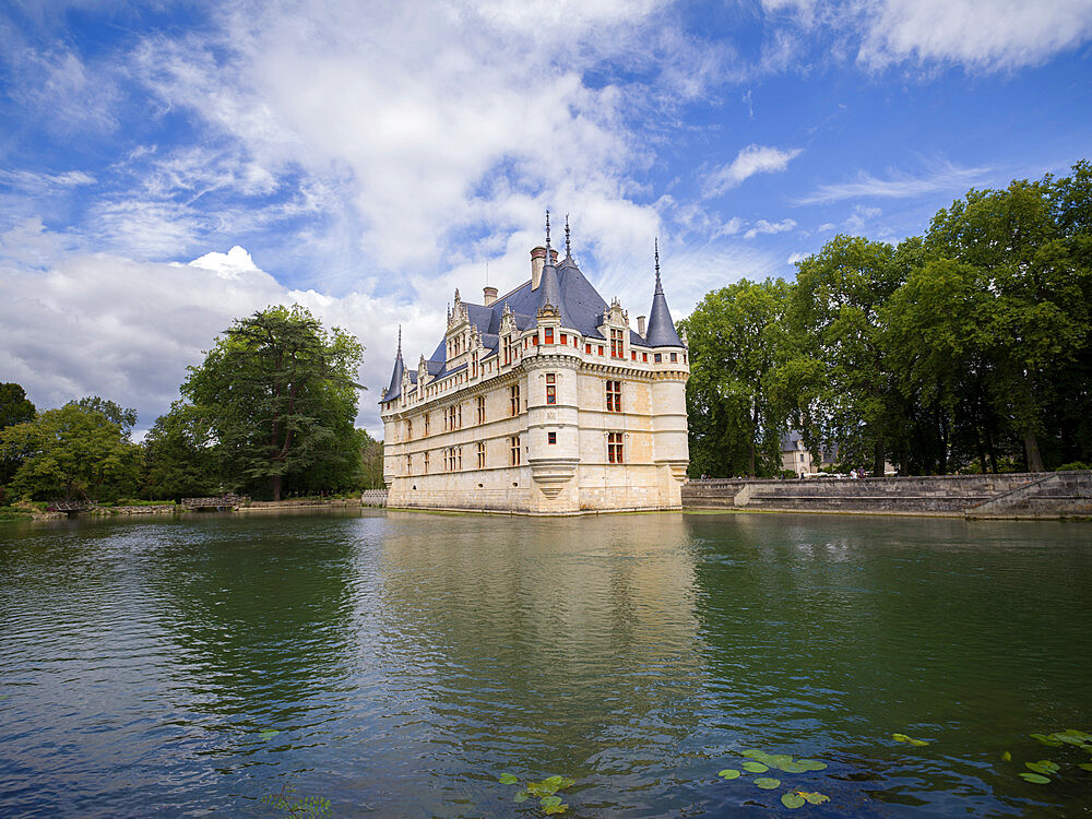 Castle of Azay-le-Rideau reflected in lake in a sunny day with clouds, UNESCO World Heritage Site, Azay-le-Rideau, Indre et Loire, Centre-Val de Loire, France, Europe