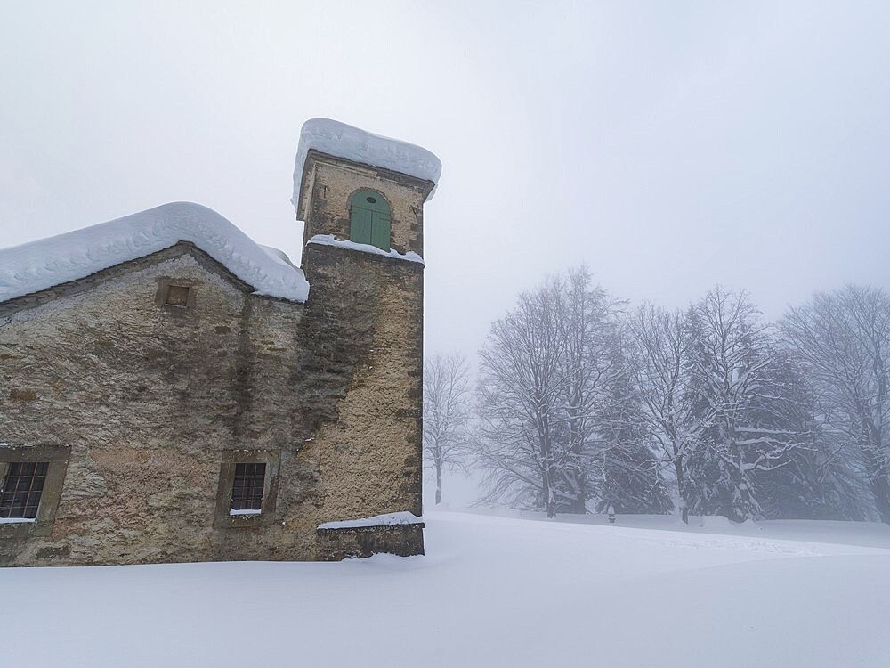 Shrine of Madonna dell'Acero covered by snow, Parco Regionale del Corno alle Scale, Emilia Romagna, Italy, Europe