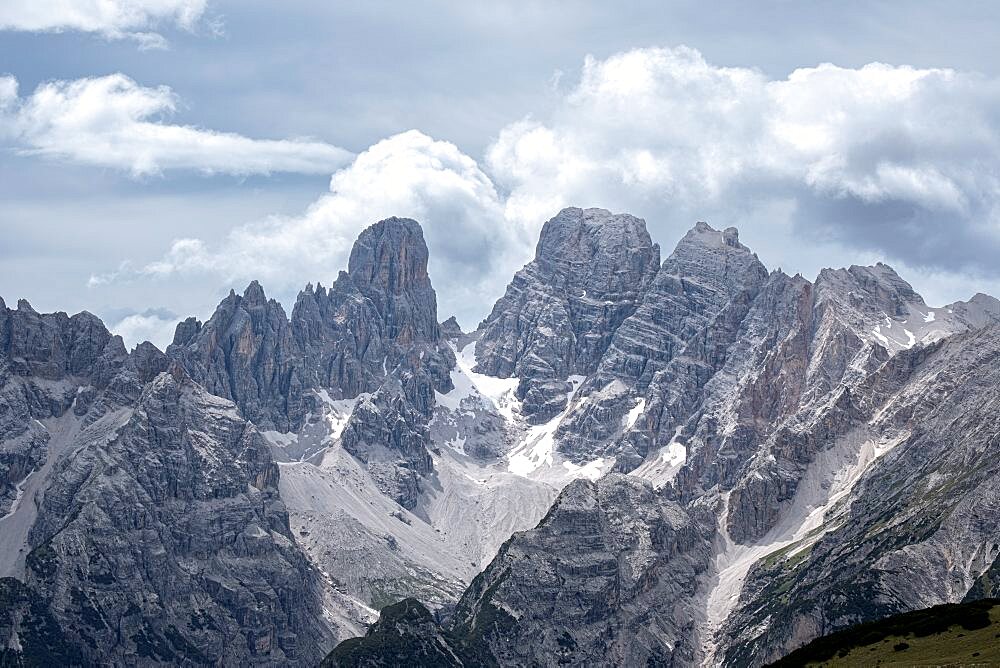 Cristallo mountain with a little snow and a sky with some clouds, dolomites, Italy