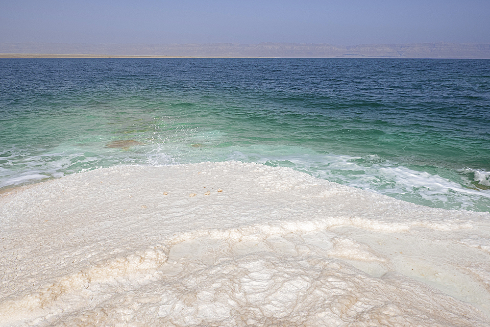 Shore with salt crystalized formation and turquoise water, The Dead Sea, Jordan, Middle East