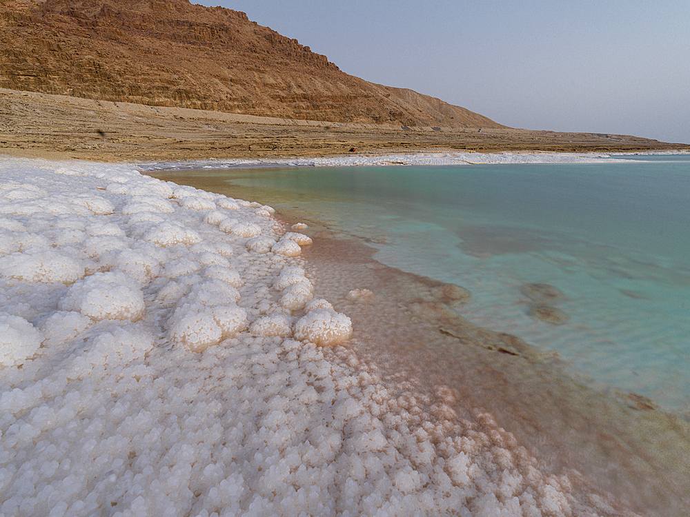 Salty shore and turquoise water of the Dead Sea, Jordan, Middle East