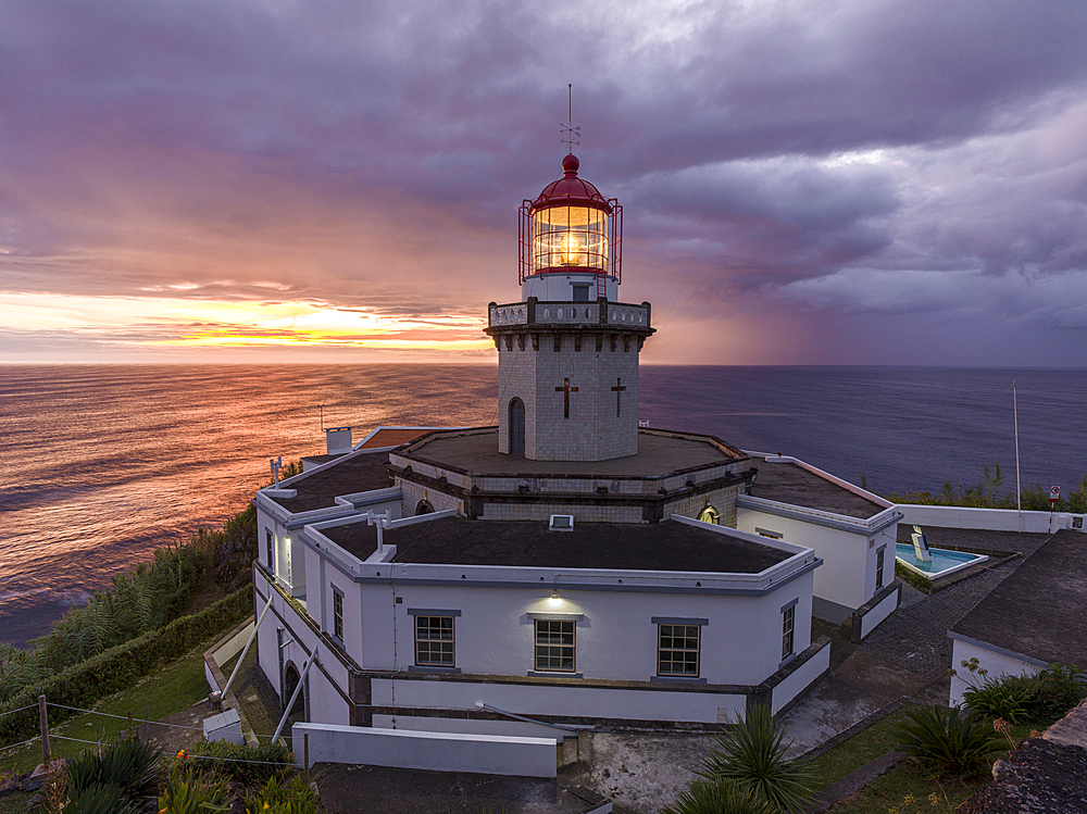 Farol do Arnel lighthouse at sunrise in a cloudy morning, Sao Miguel island, Azores, Portugal, Atlantic, Europe