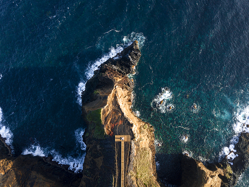 Aerial view of the coasts and cliffs of the island of Sao Miguel over the lighthouse of Farolim dos Fenais da Ajuda, Azores Islands, Portugal, Atlantic, Europe