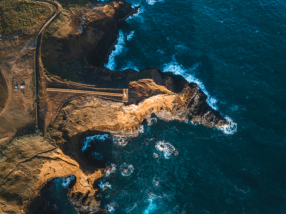 Aerial view of the coasts and cliffs of the island of Sao Miguel over the lighthouse of Farolim dos Fenais da Ajuda, Azores Islands, Portugal, Atlantic, Europe