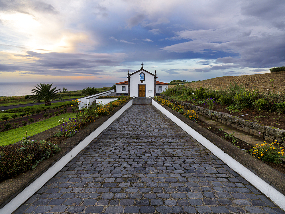 Cloudy sky at sunset over Ermida de Nossa Senhora do Pranto little church in the north of Sao Miguel Island, Azores Islands, Portugal, Atlantic, Europe