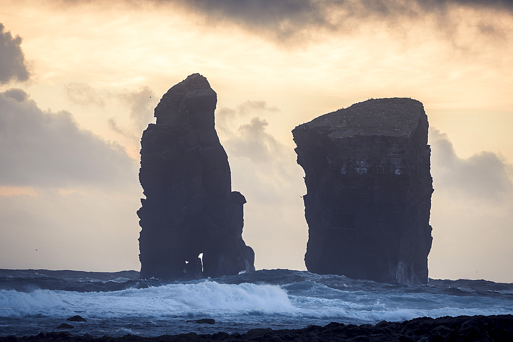 The sea stacks of Mosteiros at sunset with high waves in the foreground, Sao Miguel Island, Azores Islands, Portugal, Atlantic, Europe