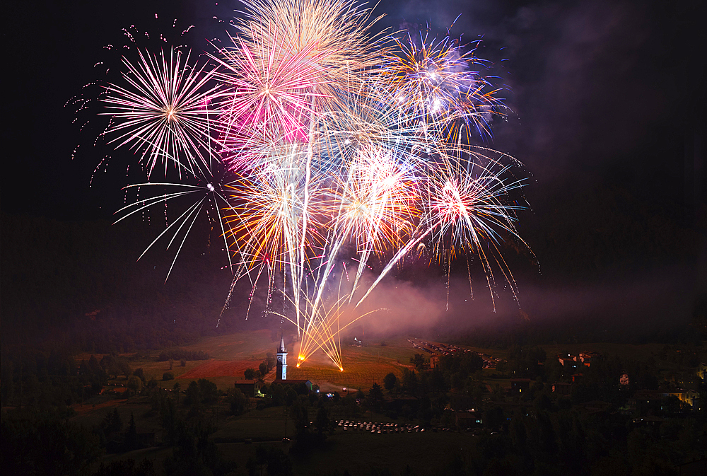 Magnificent fireworks over a small countryside church in Val d'Aiano, Emilia Romagna, Italy, Europe