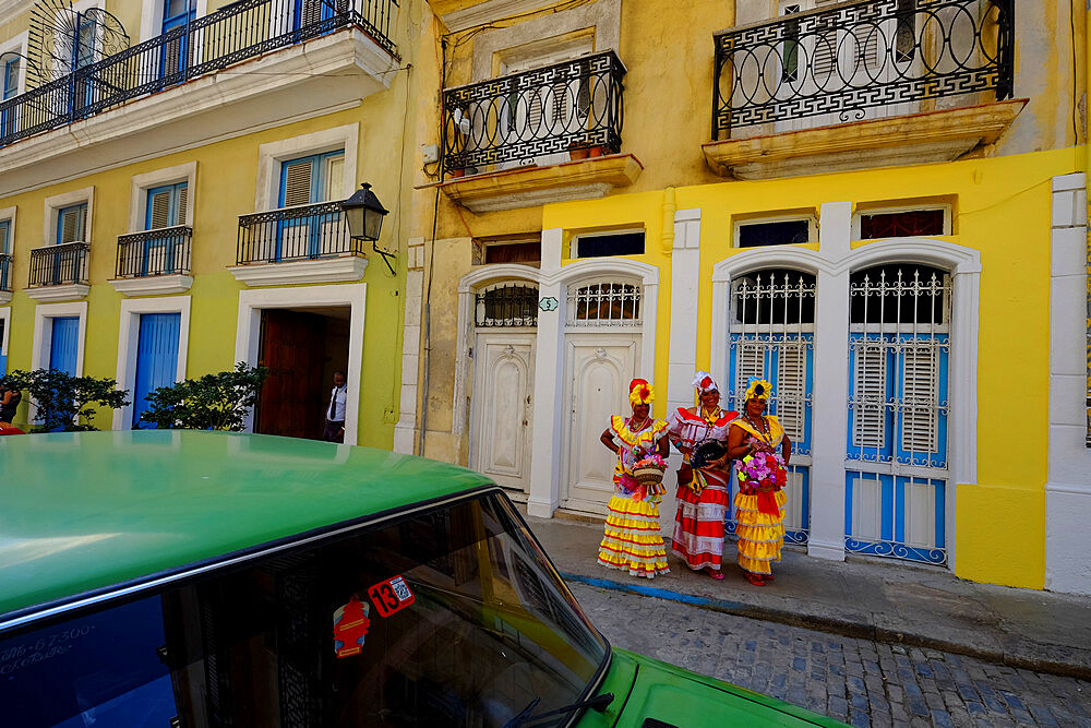 Three colorful ladies in traditional dress, Old Havana, Cuba, West Indies, Central America