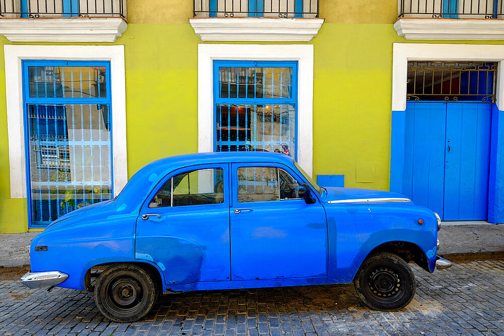 Old car parked in front of a colorful building, Old Havana, Cuba, West Indies, Central America