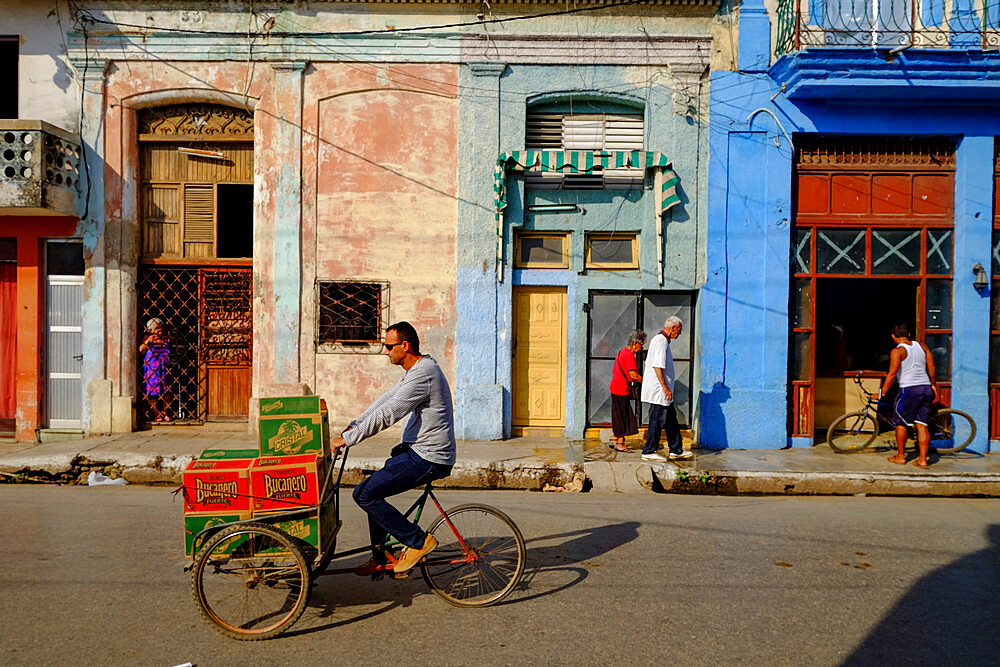 Bicycles and pedestrians on the street, Cardenas, Matanzas, Cuba, West Indies, Central America