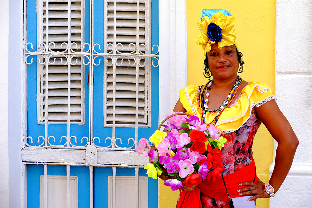 Colorful lady in traditional dress, Old Havana, Cuba, West Indies, Central America