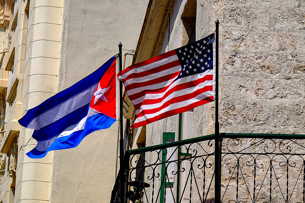 Cuban and American flags waving side by side, Old Havana, Cuba, West Indies, Central America