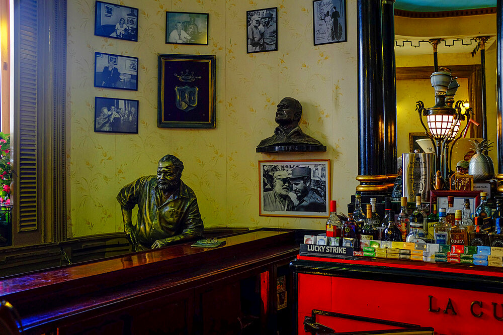 Sculpture of Ernest Hemingway sitting at the bar of the Floridita, Havana, Cuba, West Indies, Central America