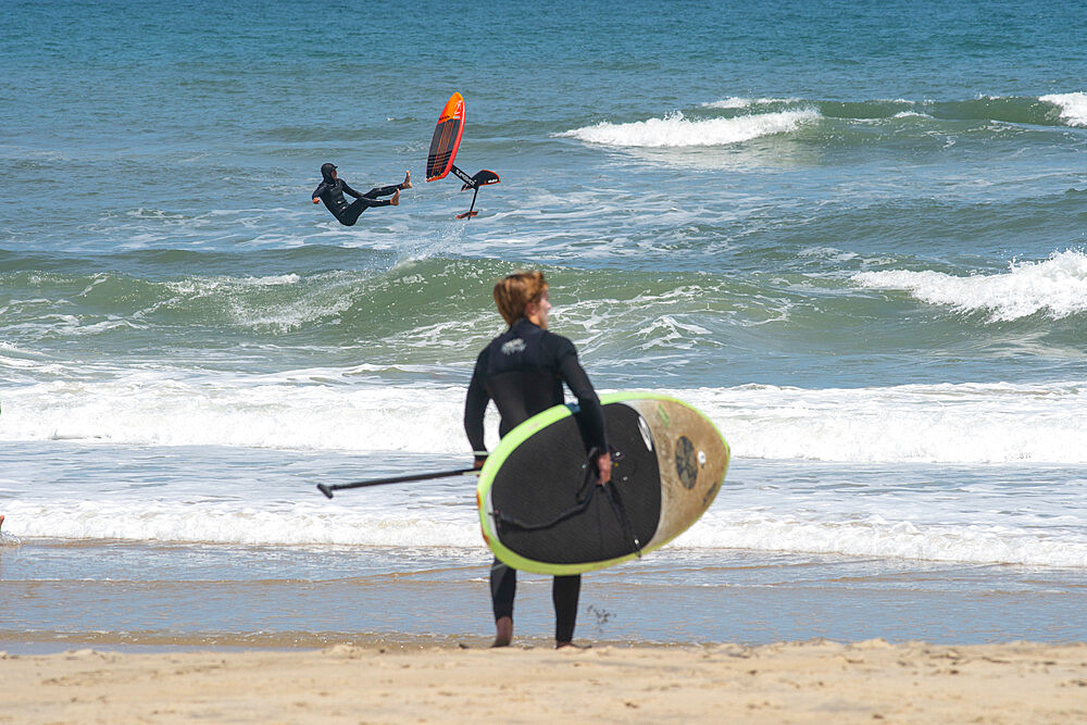 Pro surfer James Jenkins wipes out on his foiling surfboard at Nags Head, North Carolina, United States of America, North America