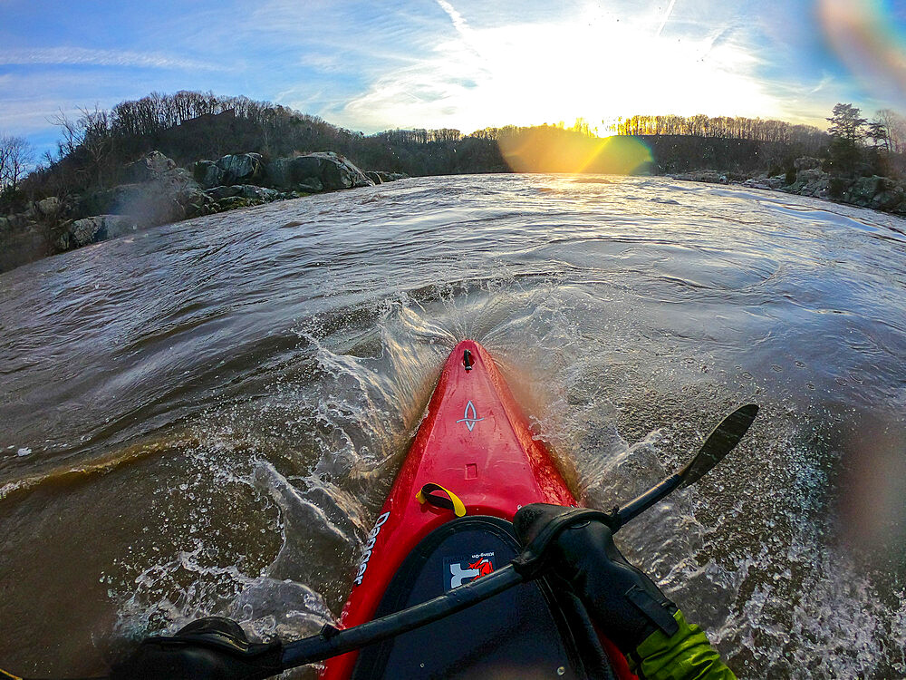 Photographer Skip Brown surfs his kayak on a whitewater wave on the Potomac River on the border of Virginia and Maryland, United States of America, North America