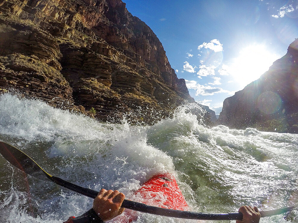 Skip Brown paddles his whitewater kayak through rapids on the Colorado River through the Grand Canyon, Arizona, United States of America, North America