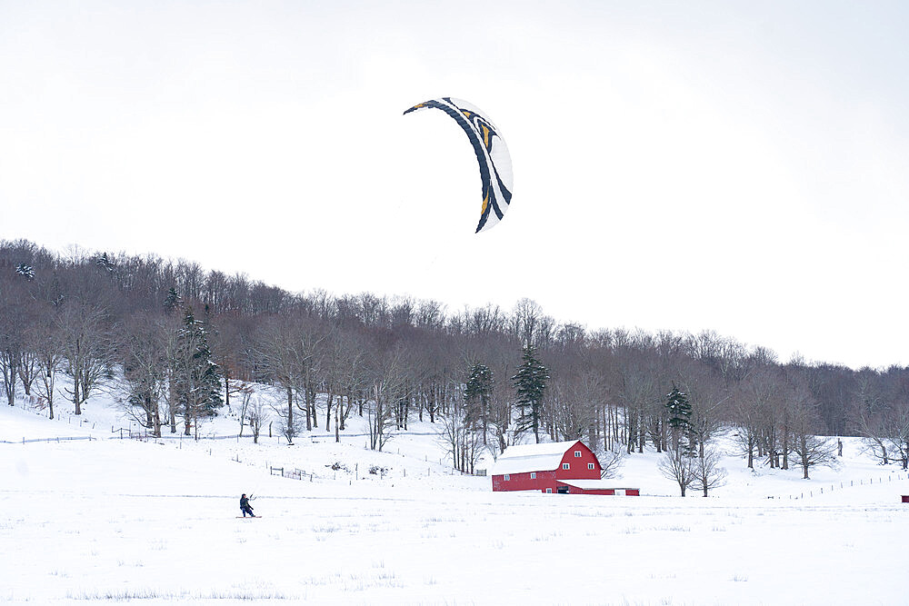 Snow kiting a snow covered farm field in Canaan Valley, West Virginia, United States of America, North America