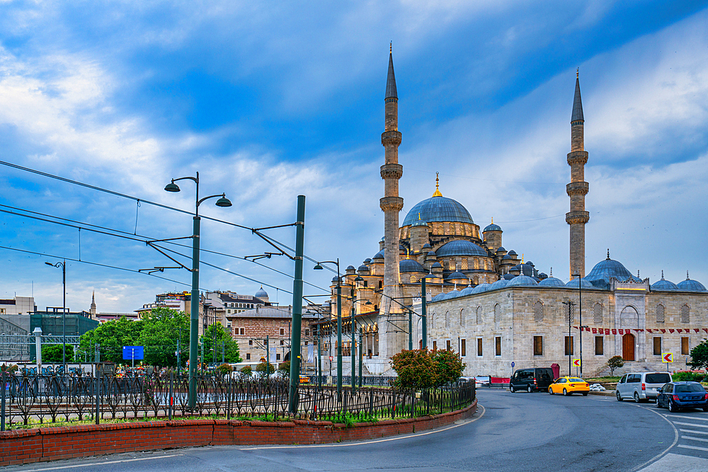Yeni mosque illuminated at sunset in Istanbul, Turkey