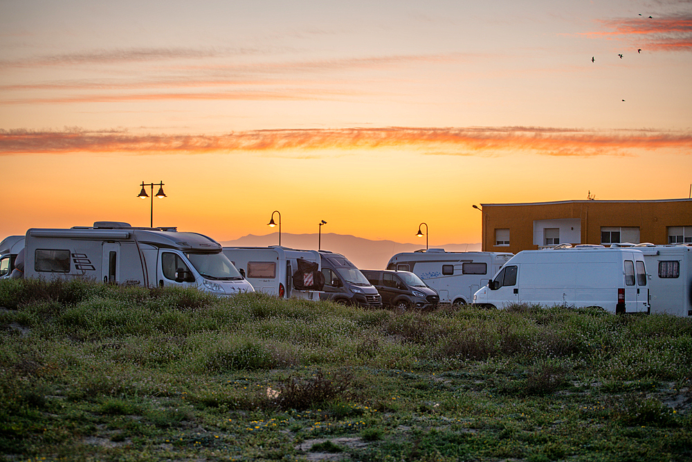 Motorhomes and camper vans on a service area at sunset, Andalusia, Spain, Europe