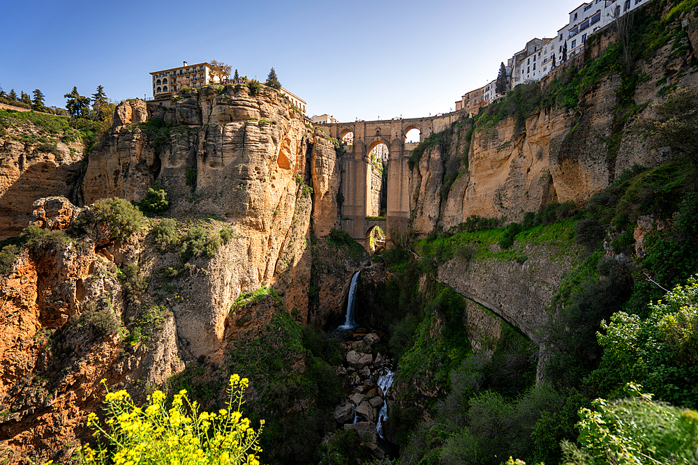 View with beautiful bridge and waterfall, a traditional white village, Ronda, Pueblos Blancos, Andalusia, Spain, Europe