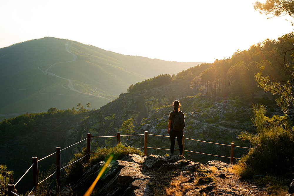 Woman looking at nature and mountain landscape from a viewpoint in Mondim de Basto, Norte, Portugal, Europe