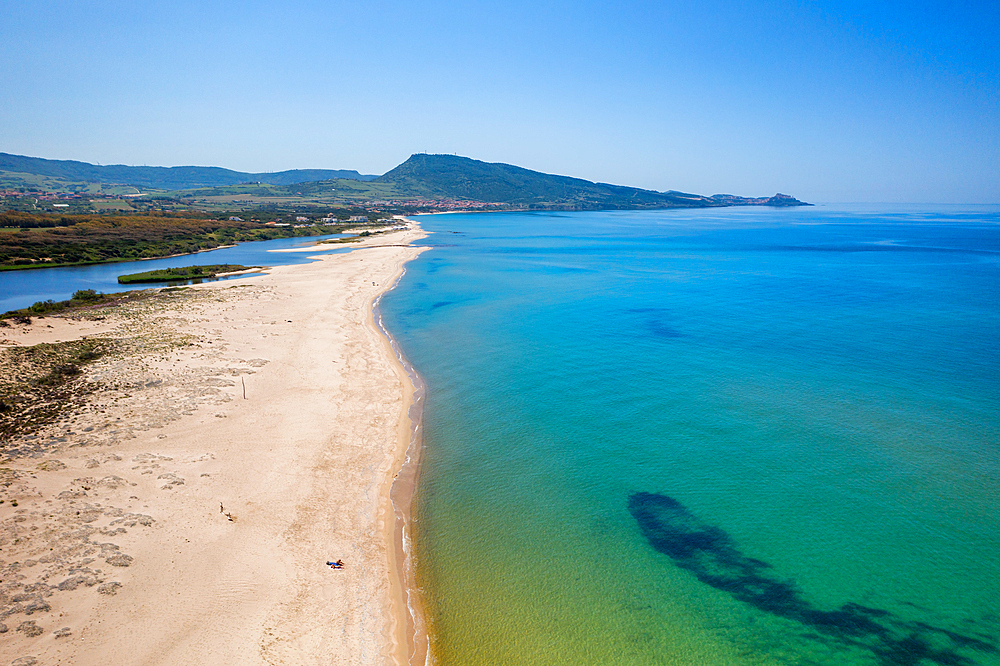 Drone aerial view of San Pietro a Mare wild beach coast with Castelsardo in the background, Sardinia, Italy, Mediterranean, Europe