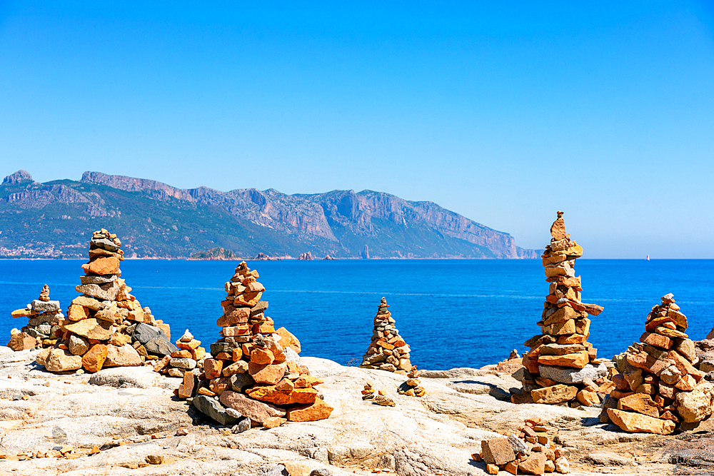 Rock towers with coastal landscape of Sardinia in the background, Sardinia, Italy, Mediterranean, Europe