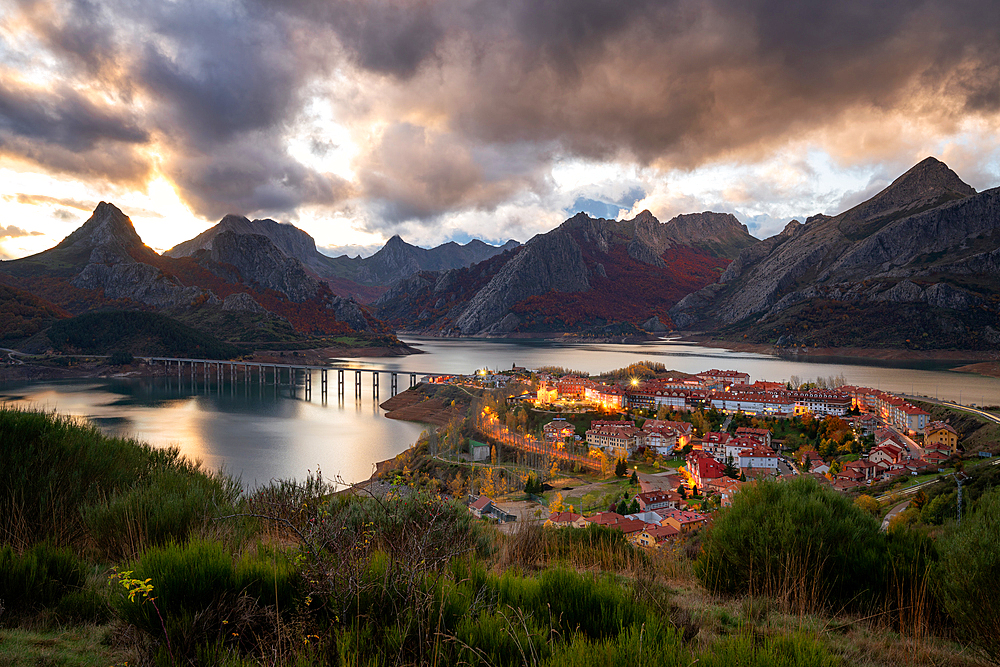 Riano cityscape at sunset with mountain range landscape during Autumn in Picos de Europa National Park, Leon, Spain, Europe