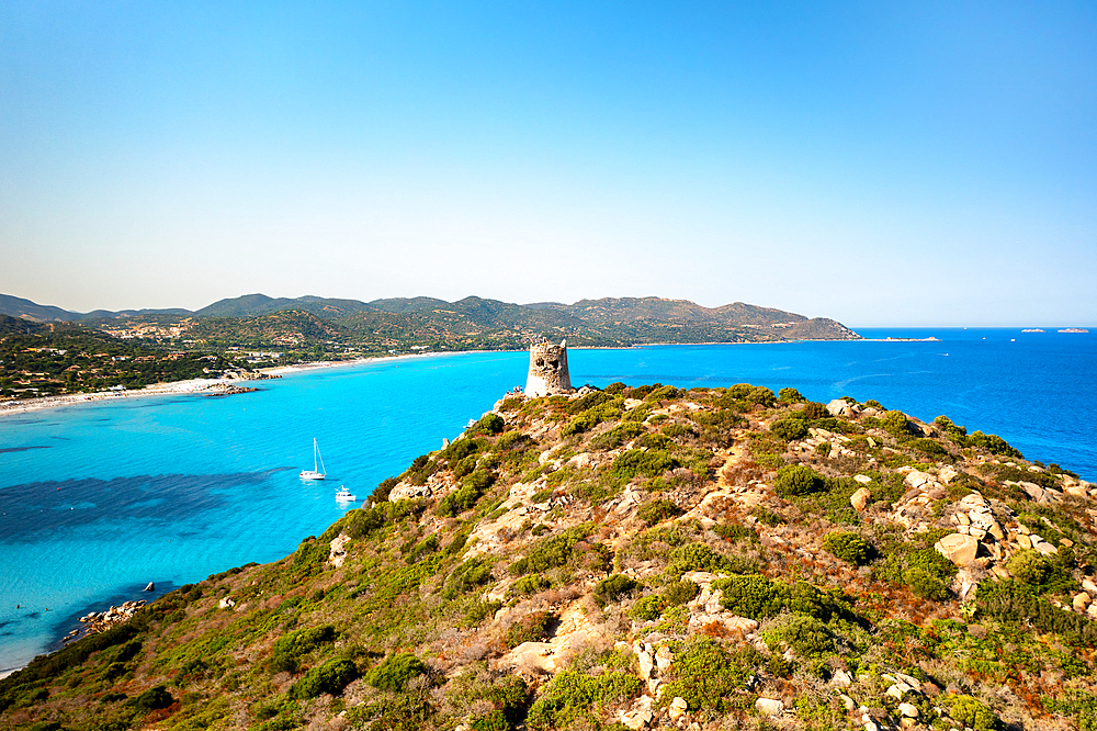 Aerial drone view of historic tower with Porto Giunco beach with white sand and turquoise water, Sardinia, Italy, Mediterranean, Europe