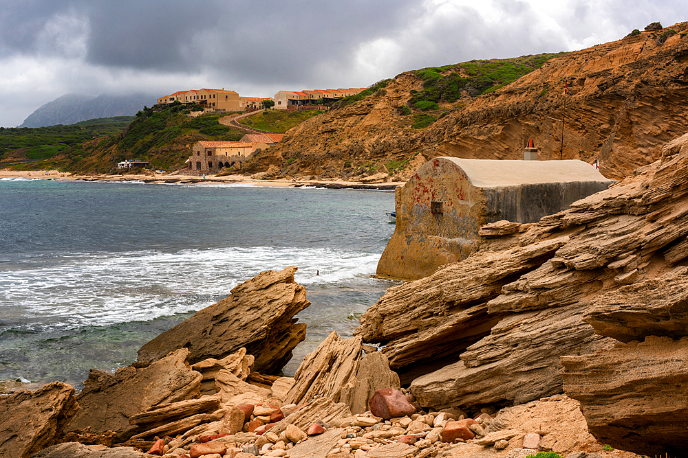 Old Fisherman's house (Casa del Pescatore) in the middle of the sea in Porto Paglia in the coast, Sardinia, Italy, Mediterranean, Europe