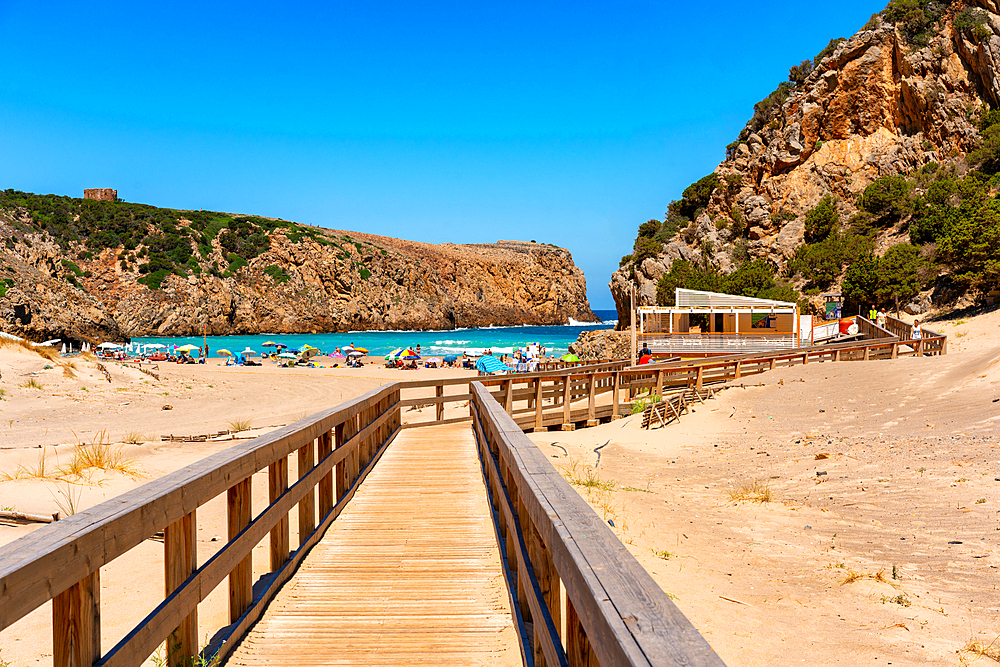 Boardwalk, Domestica Beach entrance between the cliffs with turquoise water on the coast of Sardinia, Italy, Mediterranean, Europe