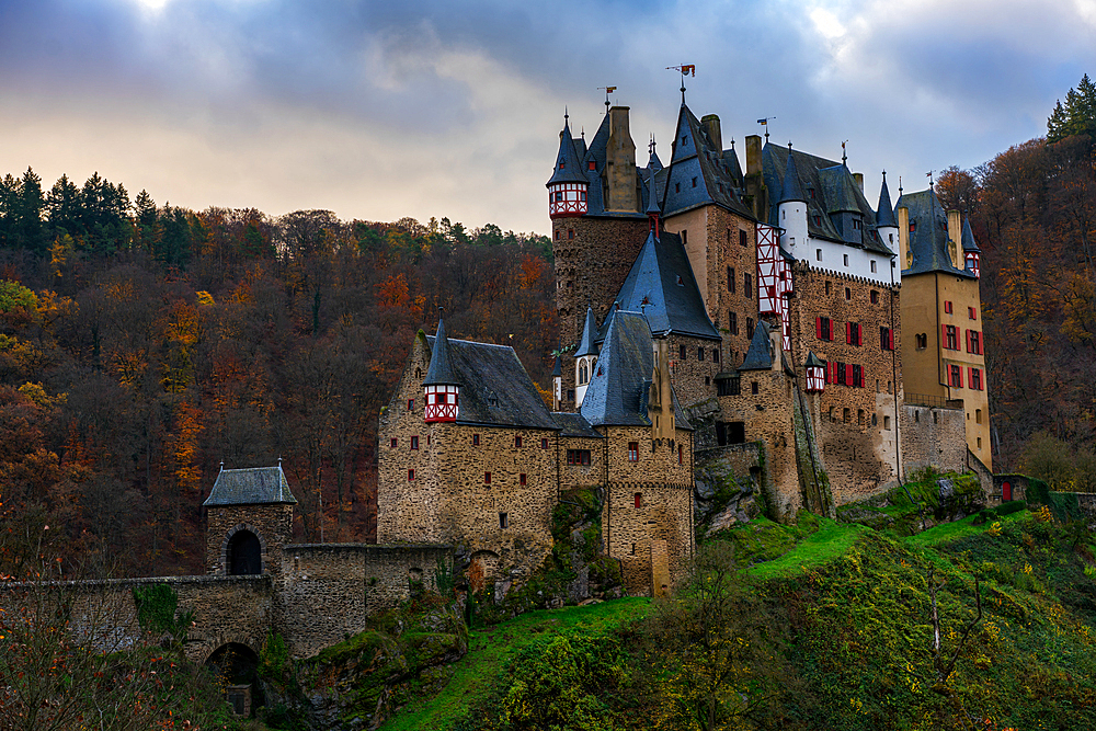 Eltz medieval historic castle in an autumn landscape with trees at sunrise, Wierschem, Rhineland-Palatinate, Germany, Europe