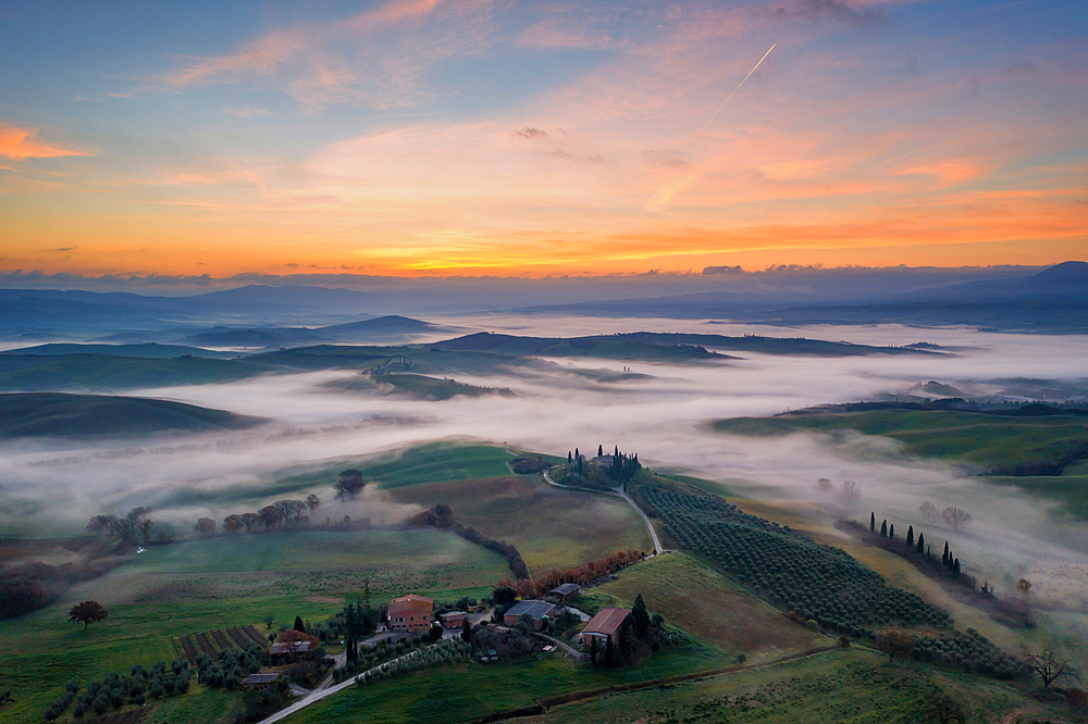 Val d'Orcia, UNESCO World Heritage Site, landscape drone aerial view with fog at sunrise, Tuscany, Italy, Europe