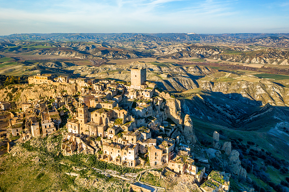 Craco ghost town abandoned by the population in the south of Italy, drone aerial view at sunset, Basilicata, Italy, Europe