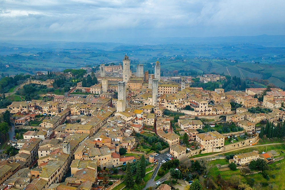 San Gimignano historic medieval village with iconic towers drone aerial view in Tuscany, Italy