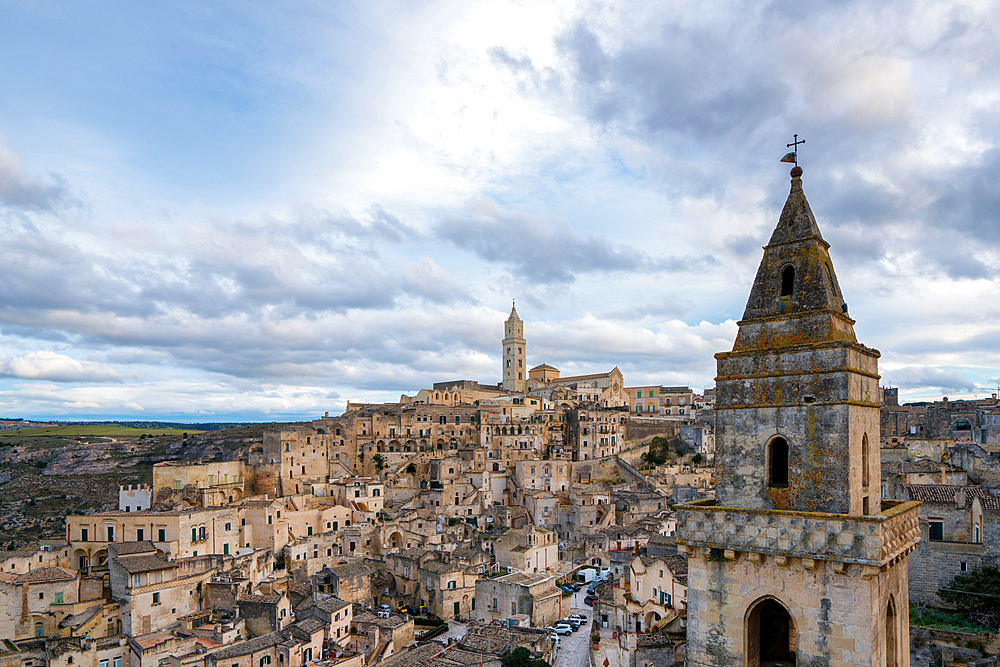 Matera ancient city view with traditional stone houses, Maria Santissima della Bruna and Sant'Eustachio cathedral and Church of Saint Peter Barisano, in Italy