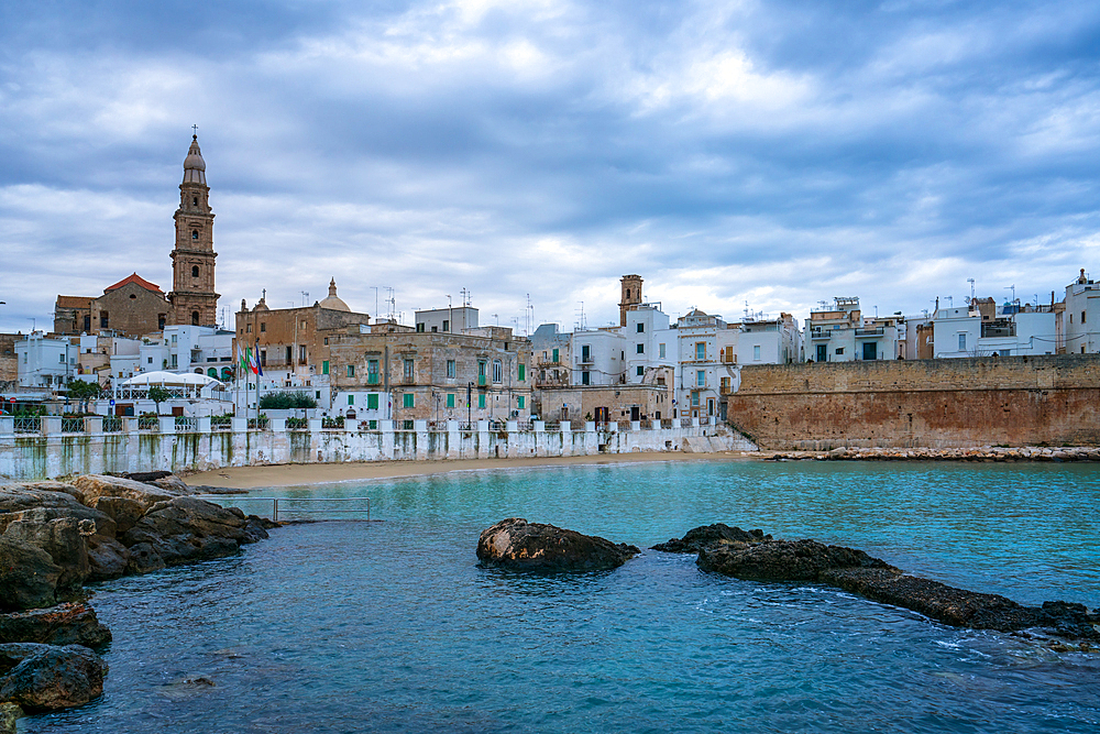 Monopoli historic city with old houses and Maria Santissima della Madia cathedral at sunset, Monopoli, Apulia, Italy, Europe